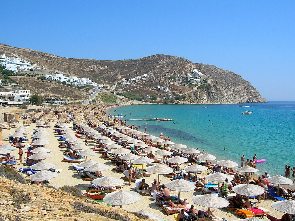 Elia Beach in Mykonos, featuring a sandy shoreline with calm water conditions