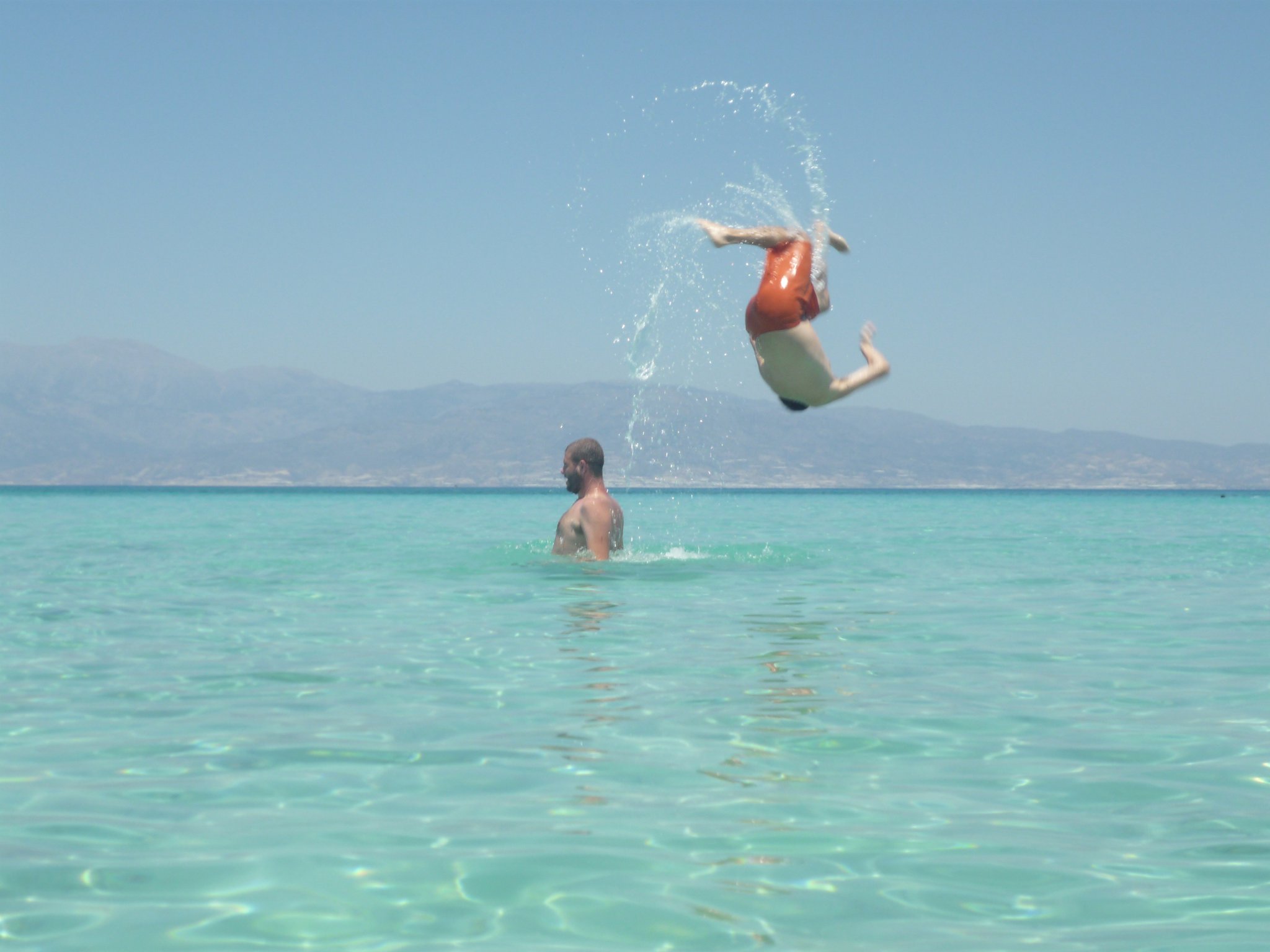 Chrissi Beach in Crete, featuring a sandy shoreline with calm water conditions