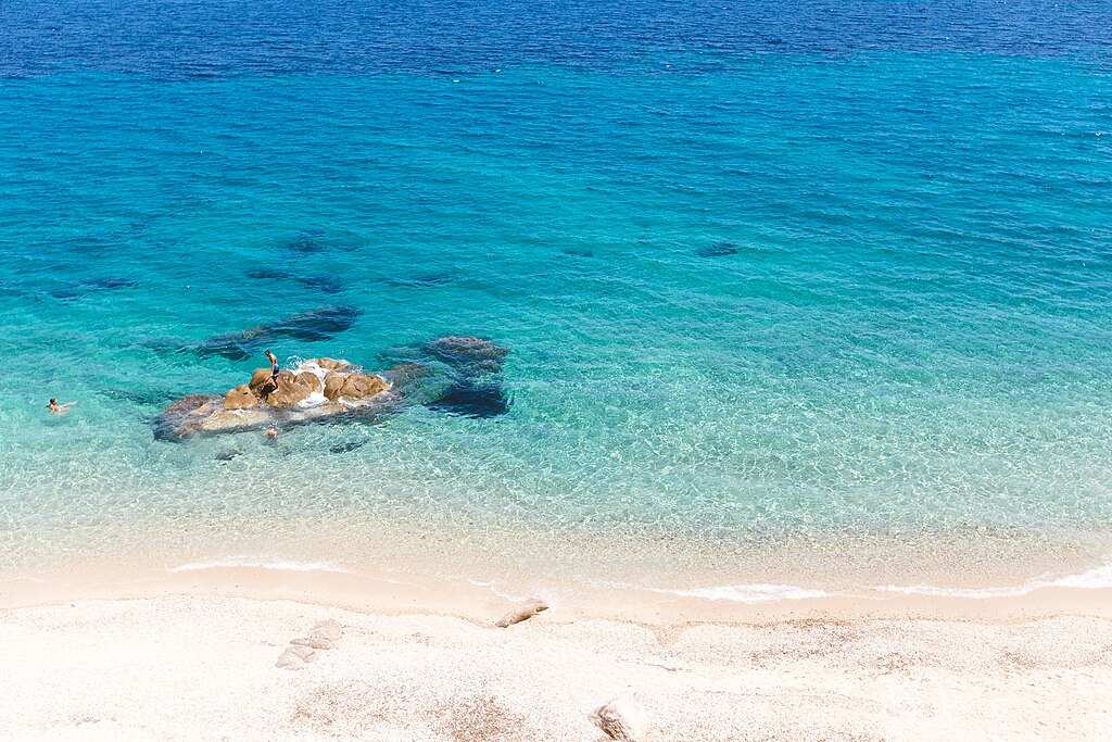 Fava Beach in Chalkidiki, featuring a mixed shoreline with moderate water conditions
