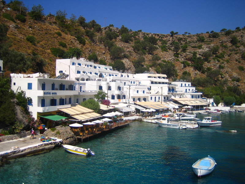 Loutro Beach in Crete, featuring a pebbly shoreline with calm water conditions