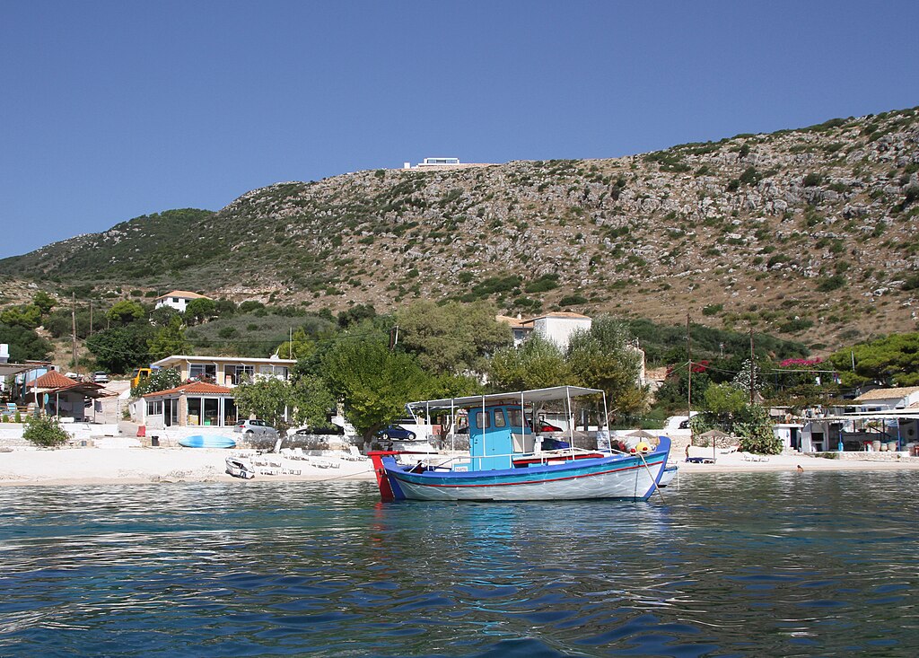 Agios Nikolaos Beach in Zakynthos, featuring a mixed shoreline with moderate water conditions