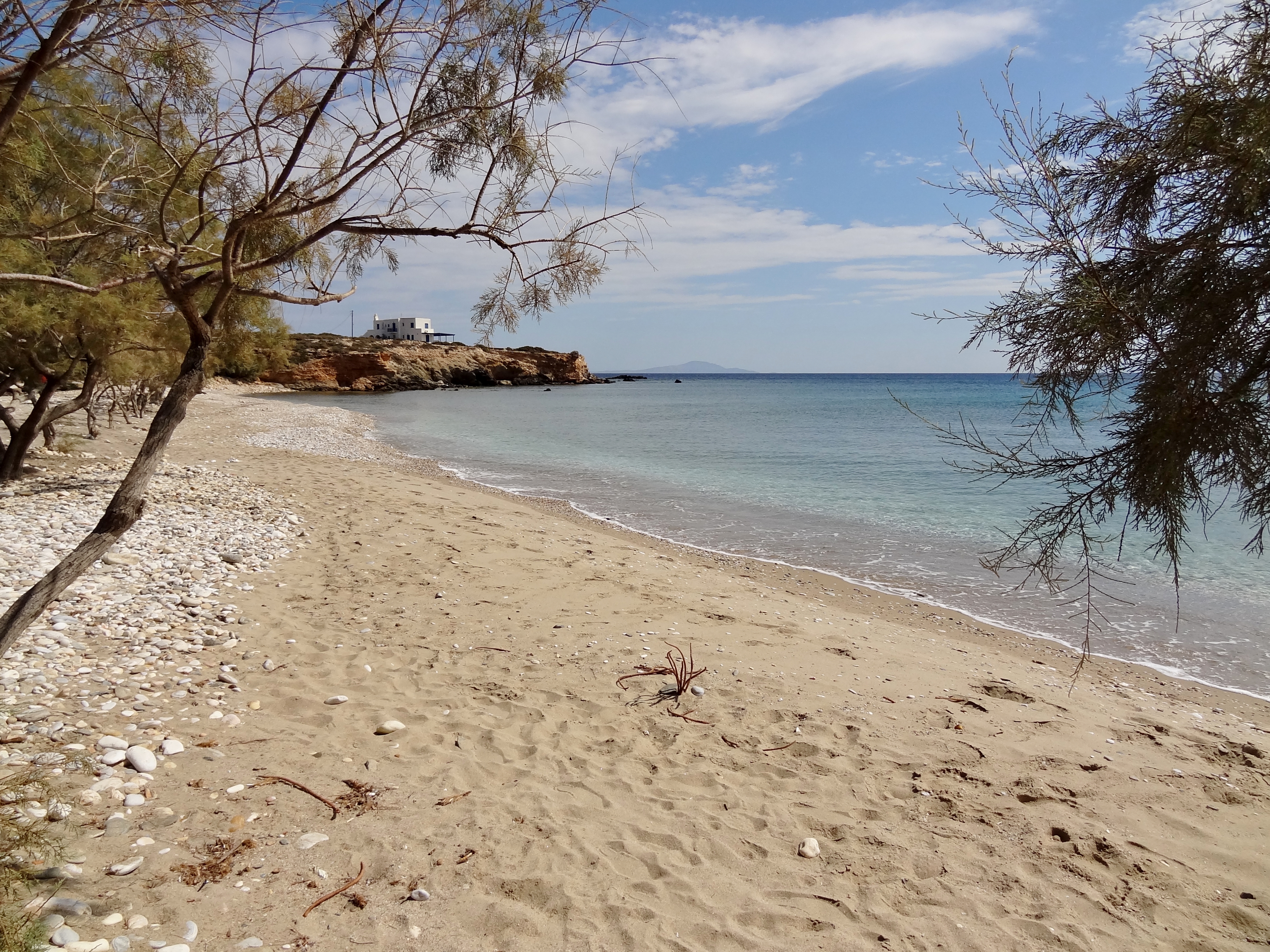 Glyfa Beach in Paros, featuring a sandy shoreline with moderate water conditions