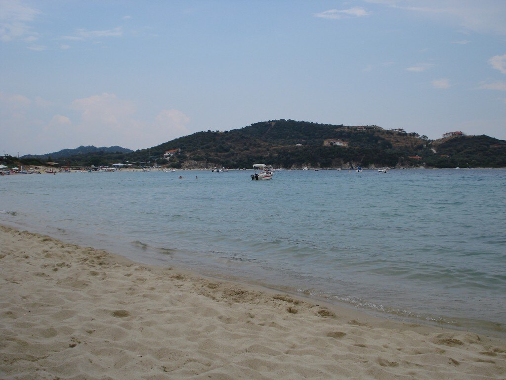 Agios Georgios Beach in Chalkidiki, featuring a sandy shoreline with calm water conditions