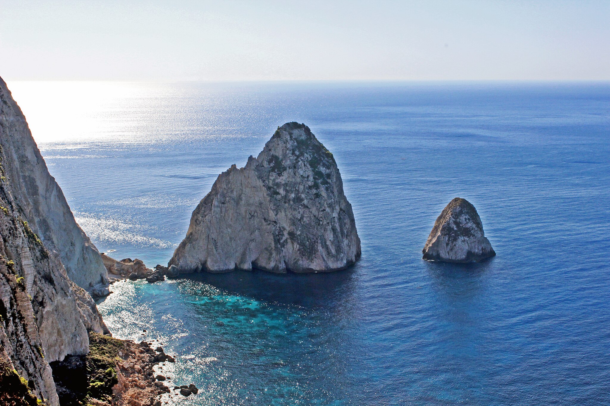 Mizithres Beach in Zakynthos, featuring a sandy shoreline with moderate water conditions