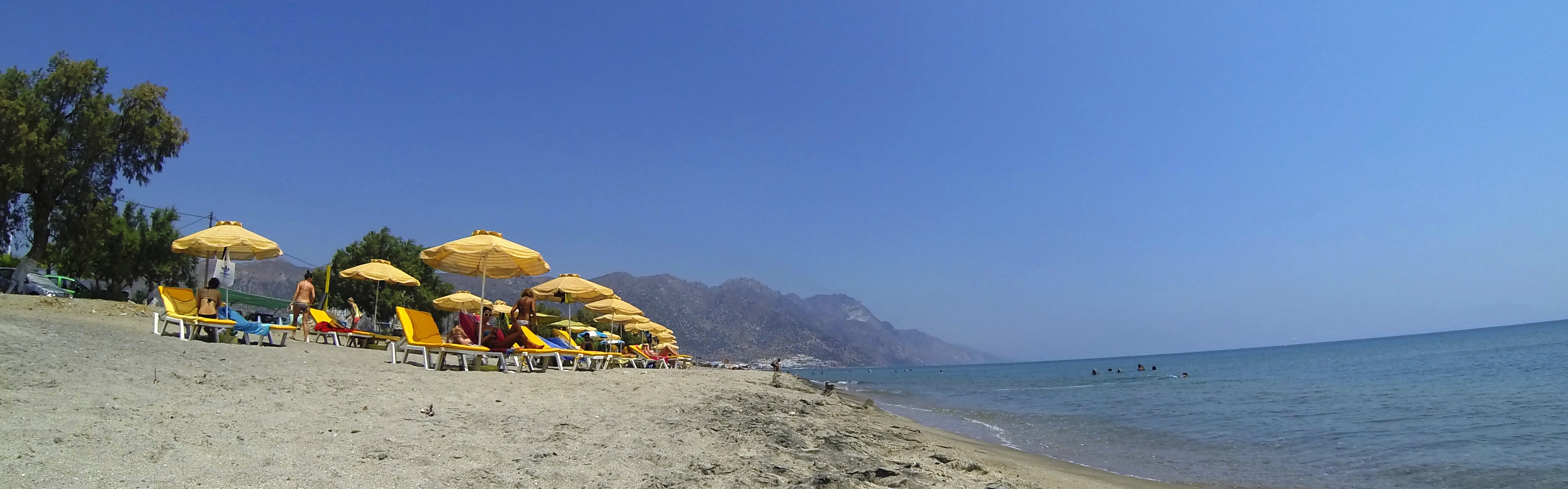 Malibu Beach in Kos, featuring a sandy shoreline with calm water conditions