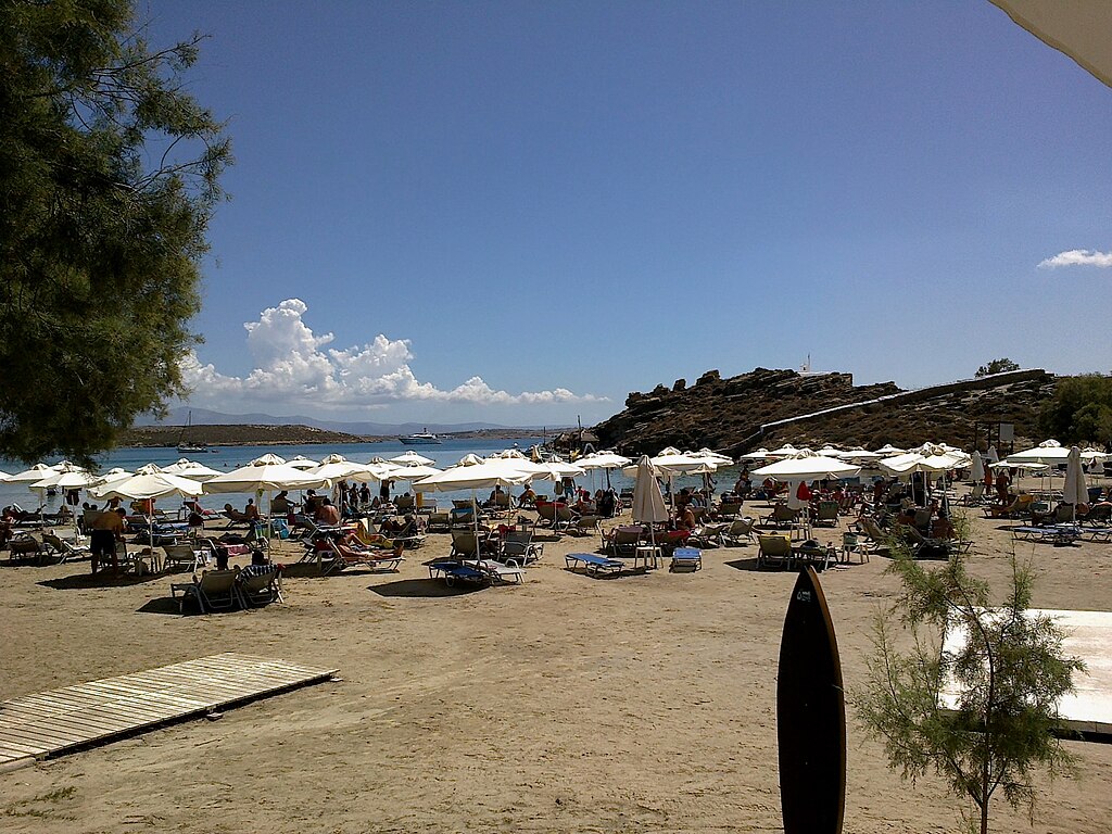 Monastiri Beach in Paros, featuring a sandy shoreline with calm water conditions
