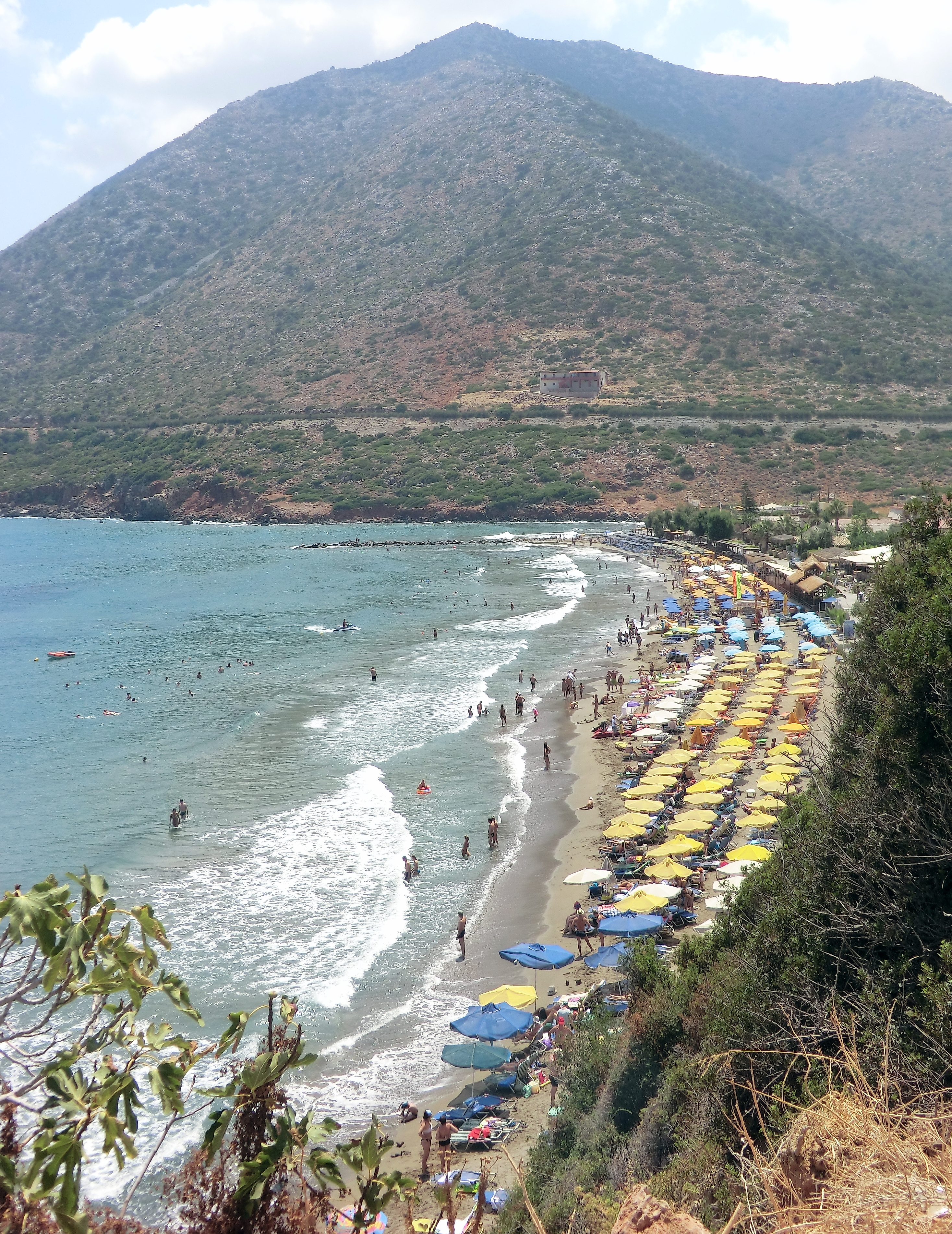 Bali Beach in Crete, featuring a sandy shoreline with calm water conditions