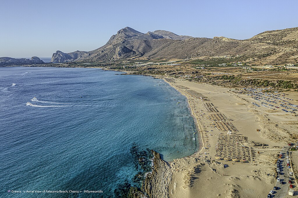 Falasarna Beach in Crete, featuring a sandy shoreline with moderate water conditions