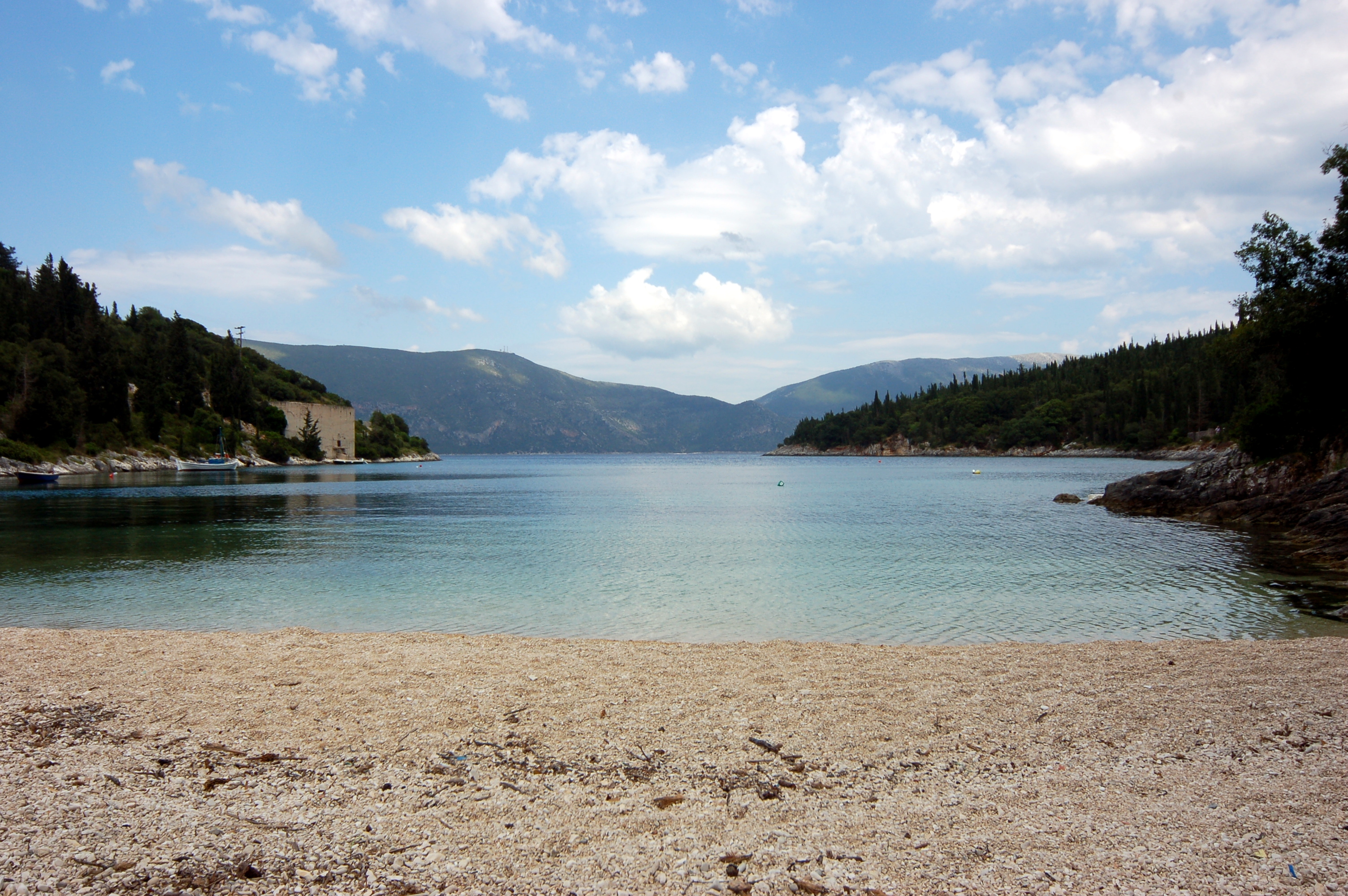 Foki Beach in Kefalonia, featuring a pebbly shoreline with calm water conditions