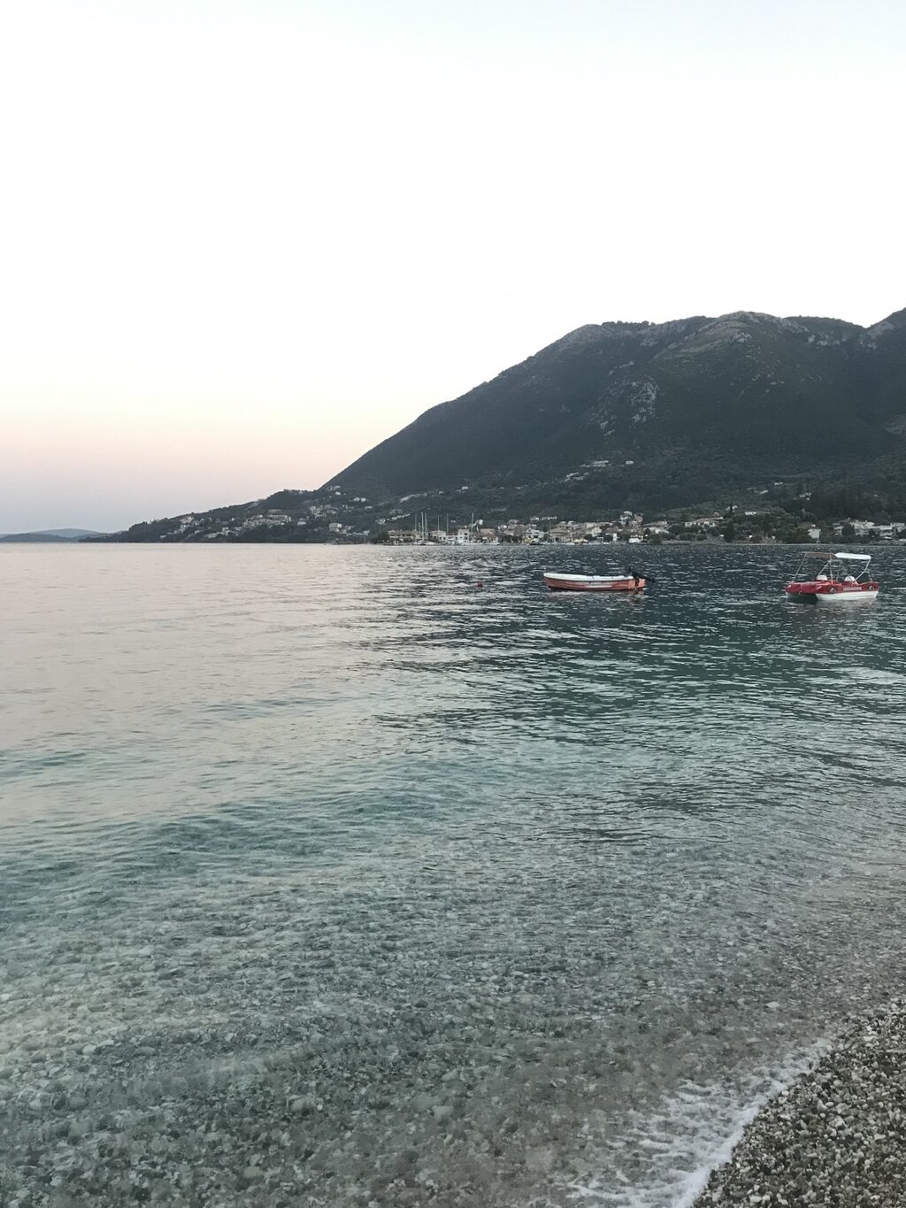 Nikiana Beach in Lefkada, featuring a mixed shoreline with calm water conditions