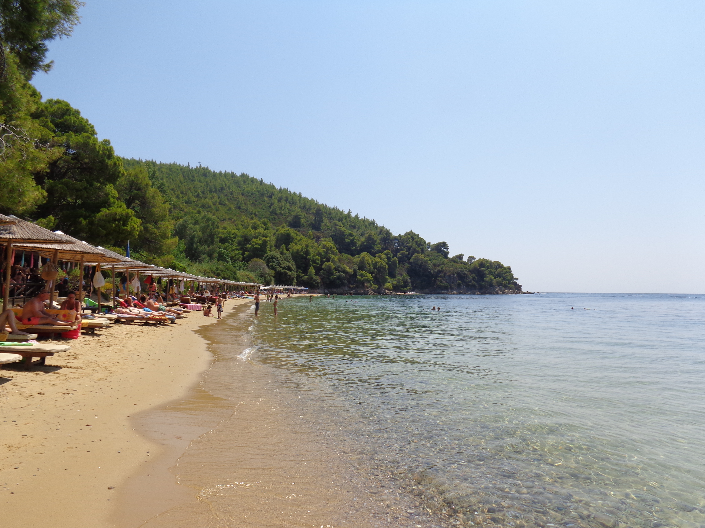 Maratha Beach in Skiathos, featuring a sandy shoreline with moderate water conditions