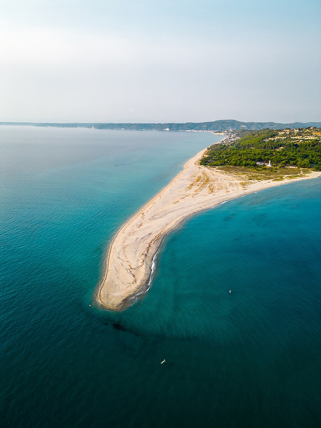 Possidi Beach in Chalkidiki, featuring a sandy shoreline with calm water conditions