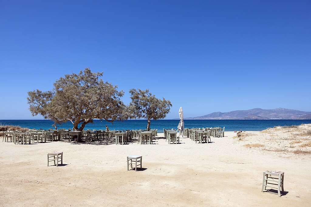 Agia Anna Beach in Naxos, featuring a sandy shoreline with moderate water conditions